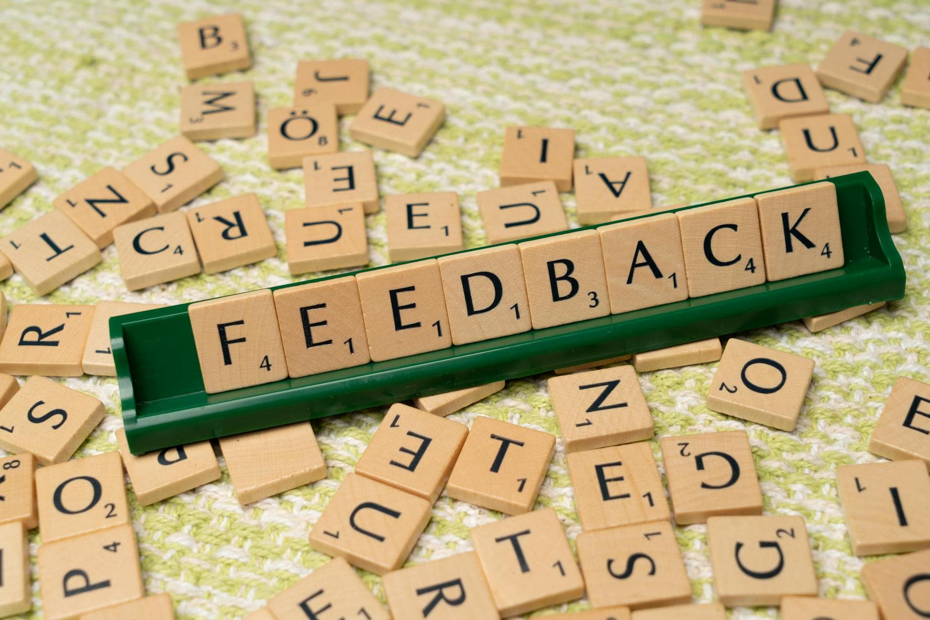 Positive customer testimonials displayed on laptop screen with five-star ratings