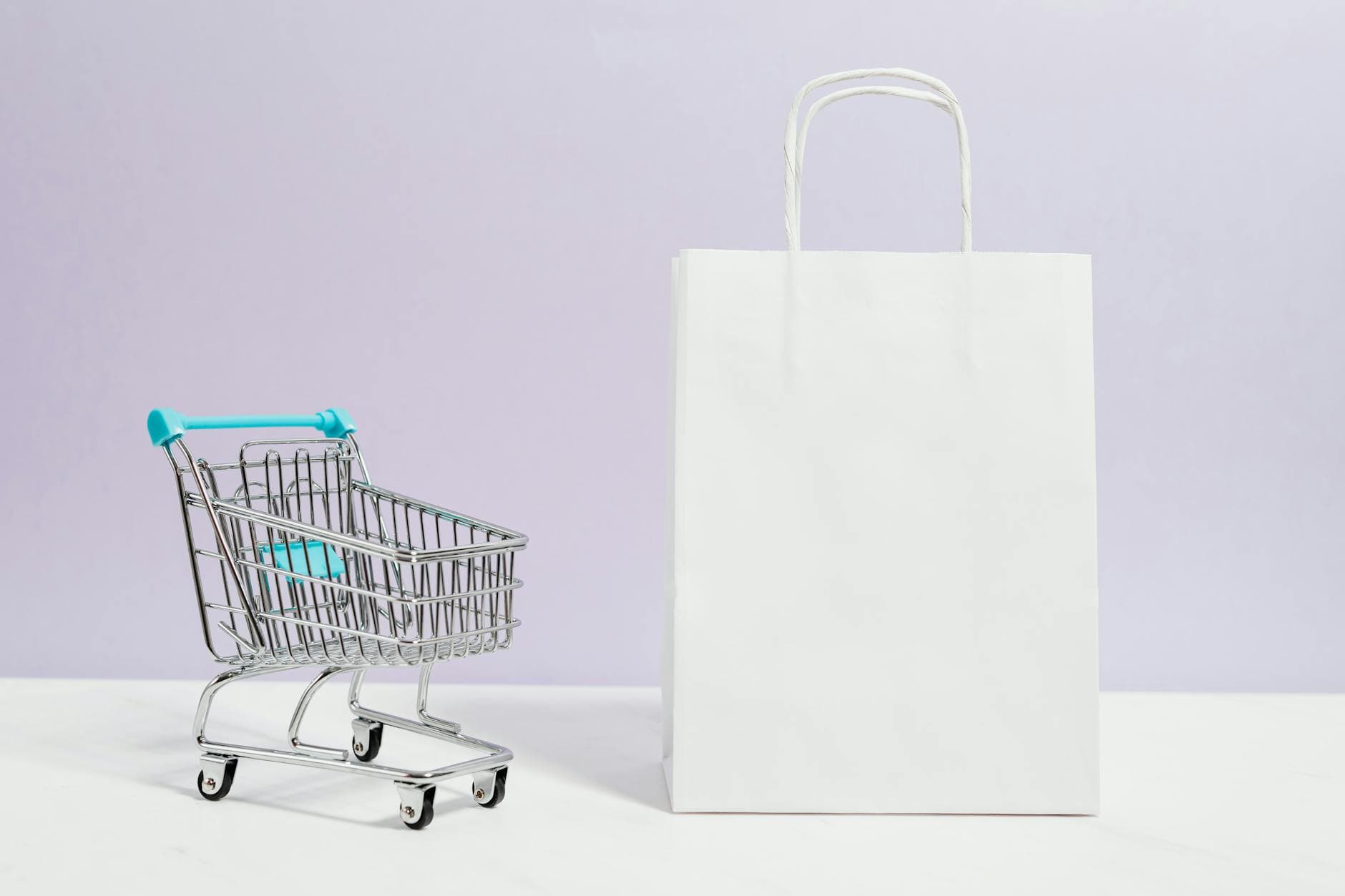 Person using laptop for online shopping with shopping cart and payment icons representing e-commerce conversion optimization