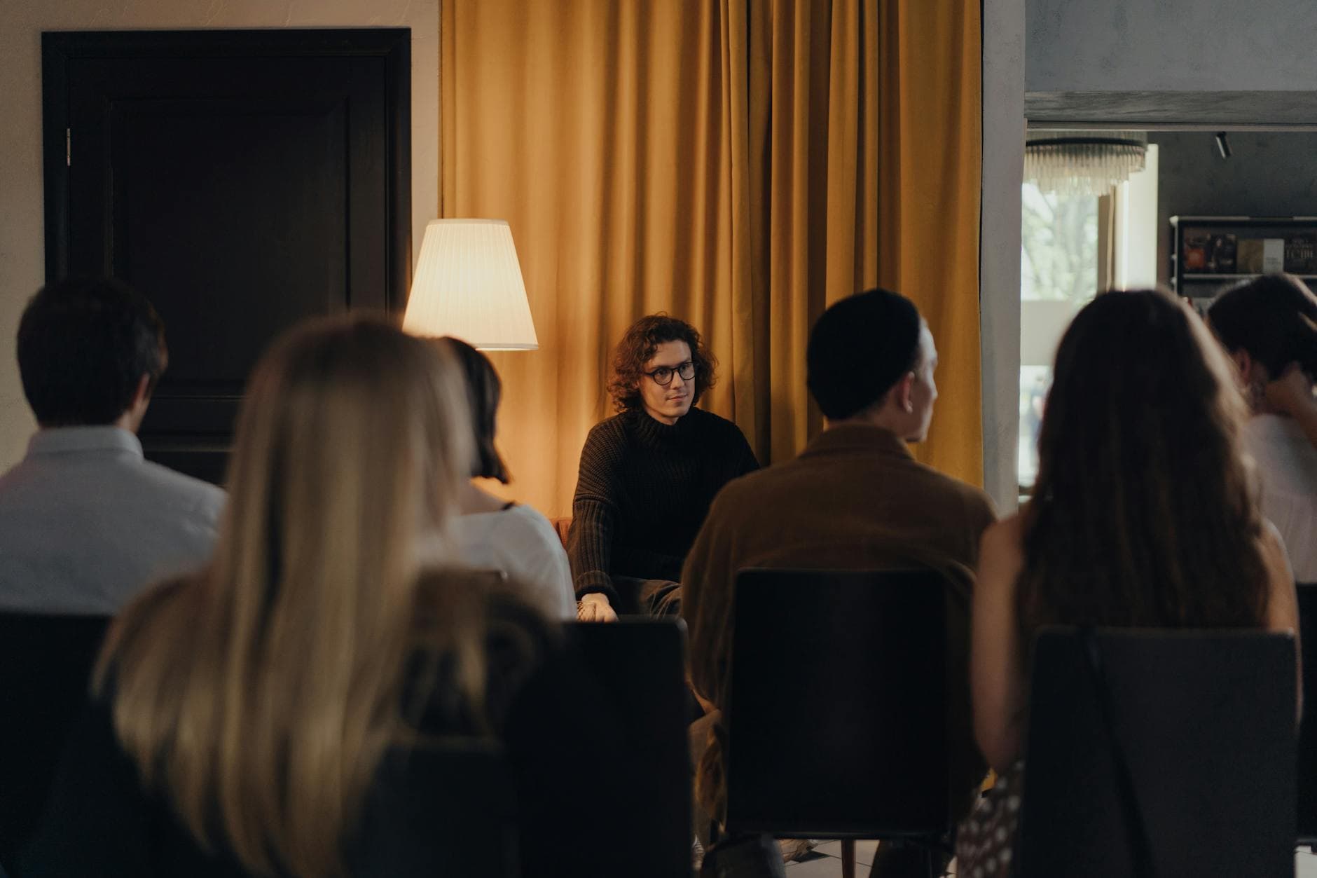 Professional standing at podium presenting expertise to engaged audience