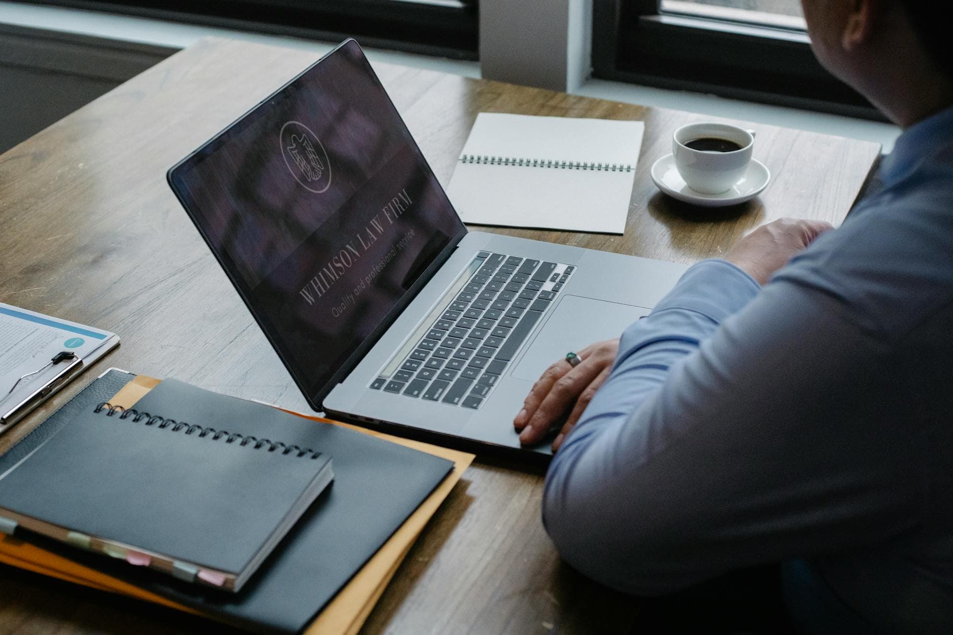 Attorney using laptop for law firm digital marketing strategy