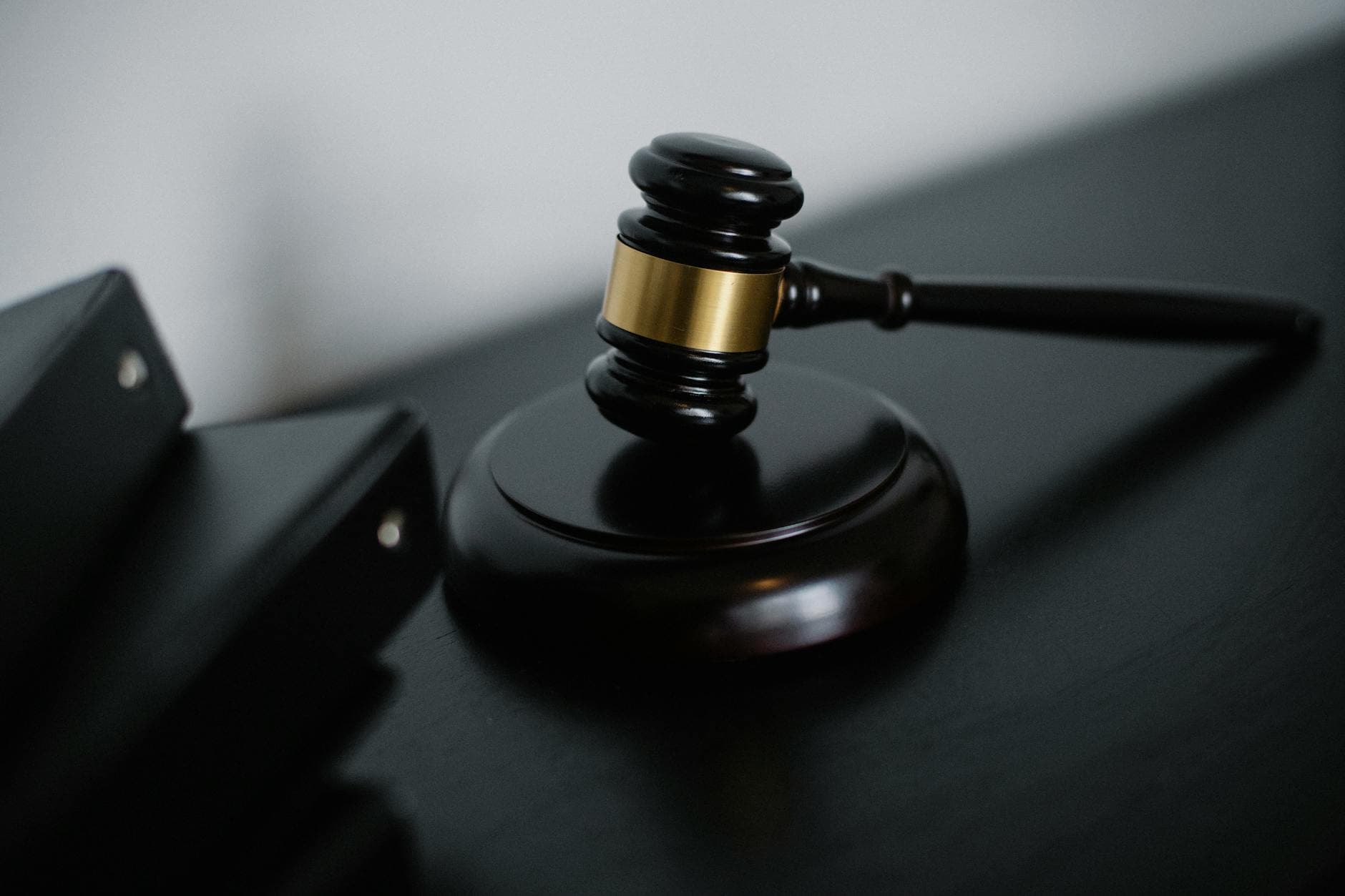Professional law firm branding materials including logo, business cards, and website design