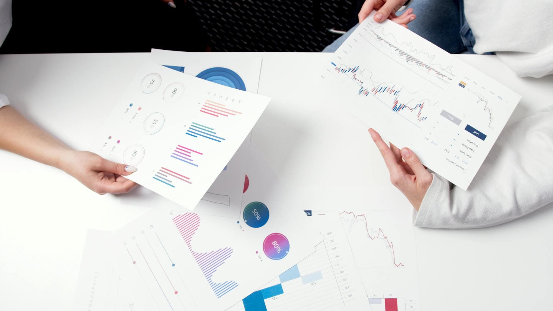 Business professional analyzing competitor data on laptop screen