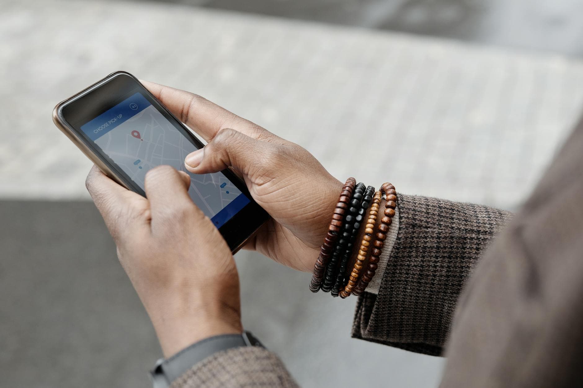 Professional electrician checking Google Business Profile on smartphone for local SEO optimization
